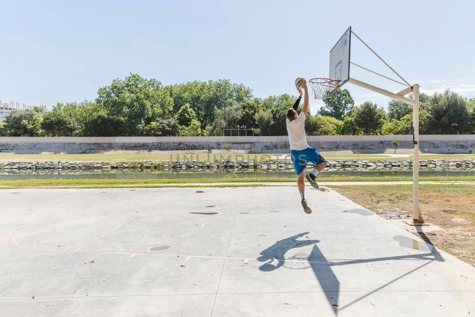 basketball player throwing basketball hoop by Zahard