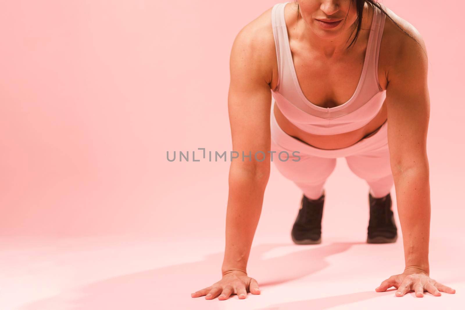 athletic woman doing push up