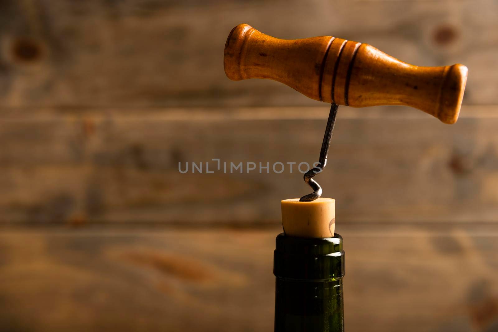 close up corkscrew with wooden background