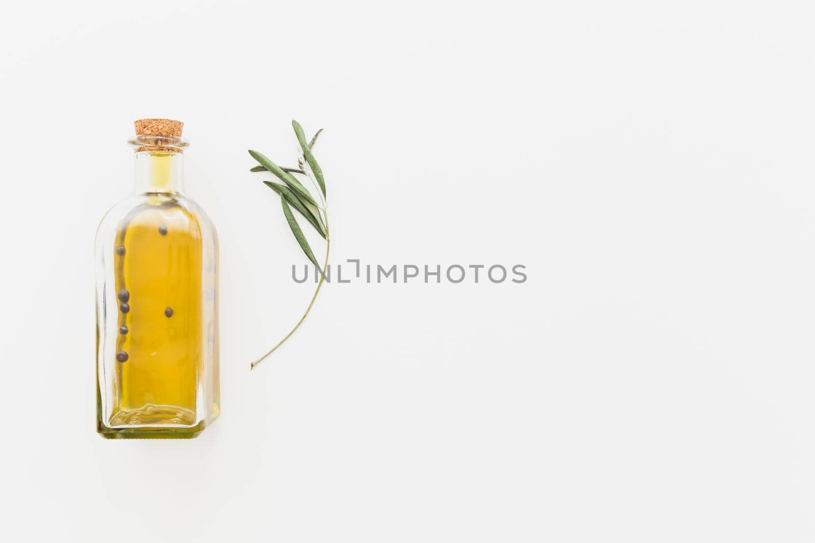 bottle oil with green branch by Zahard