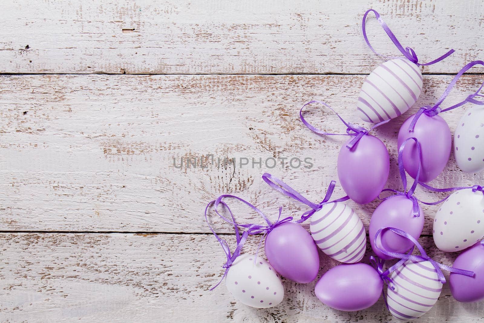 wooden table with purple easter eggs by Zahard