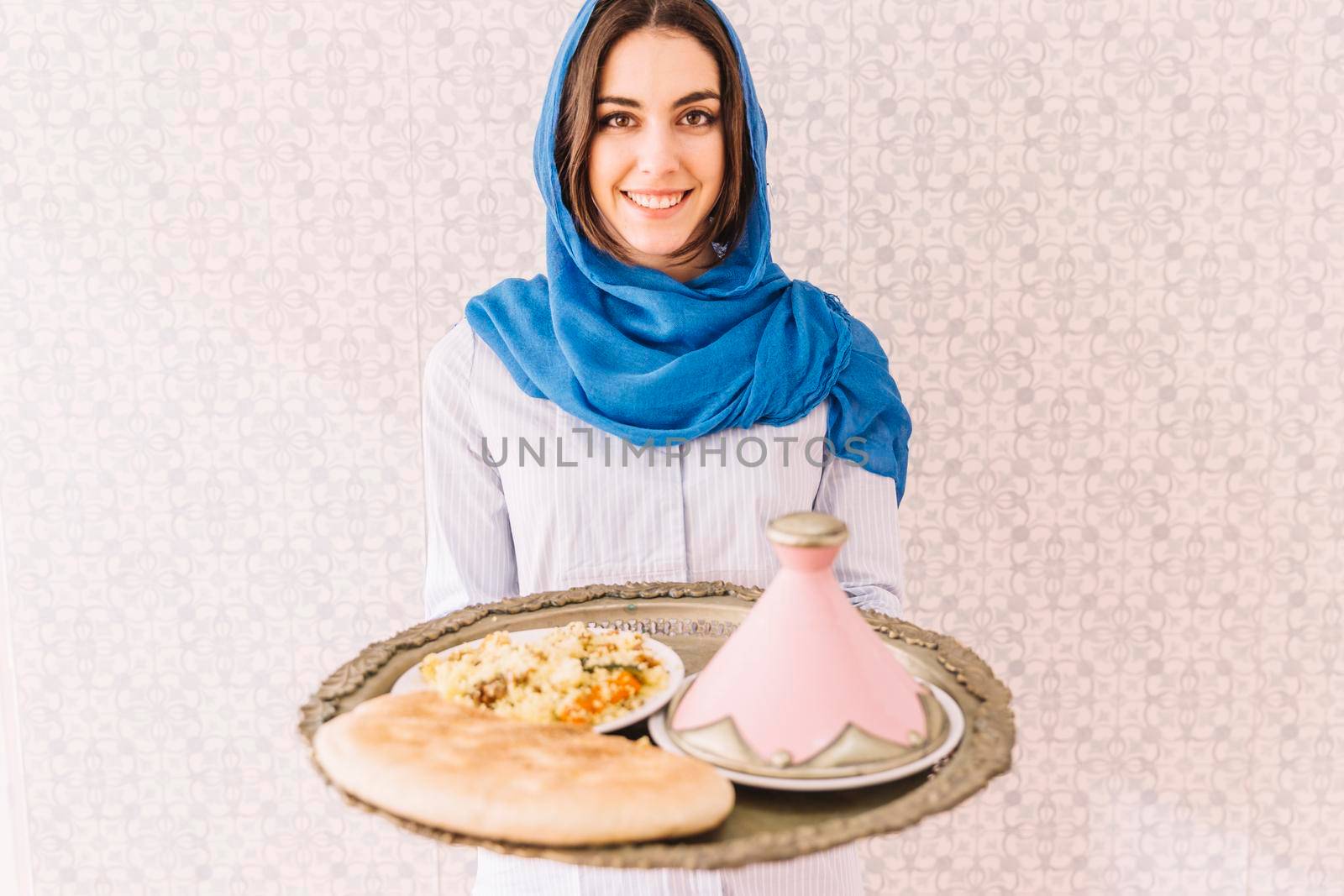 woman holding plate arab food by Zahard