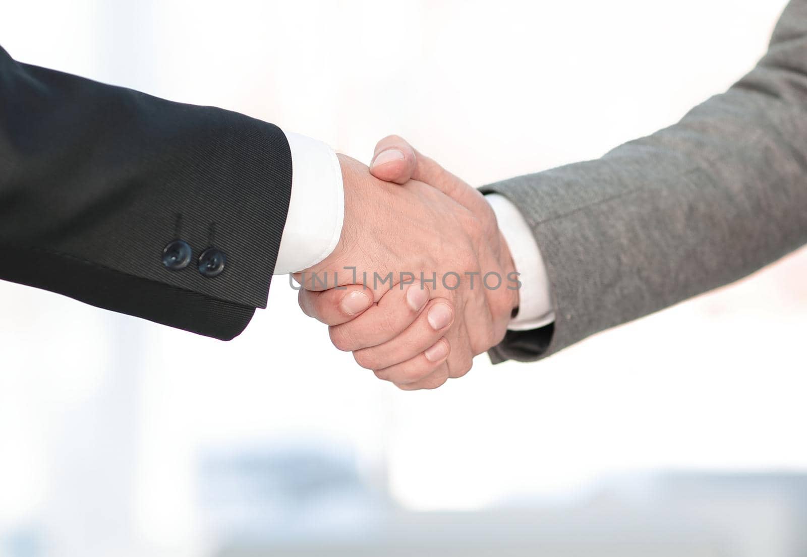 closeup.the handshake business partners in the office.photo with copy space