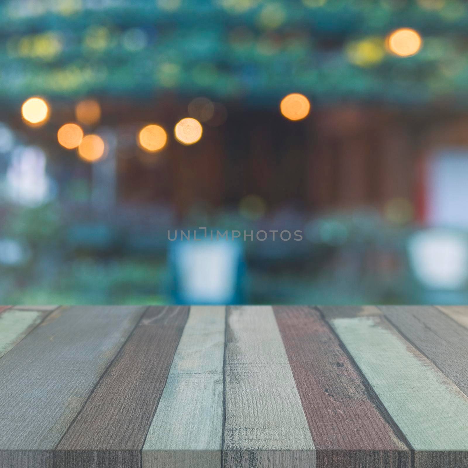 wooden table top front garden with blurred bokeh lights by Zahard
