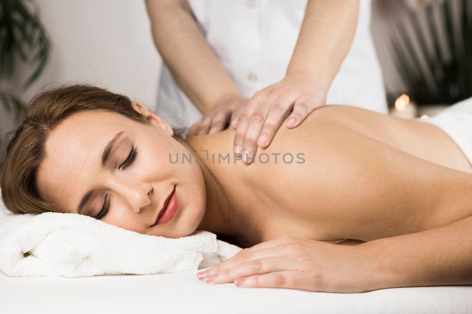 woman receiving massage spa center by Zahard