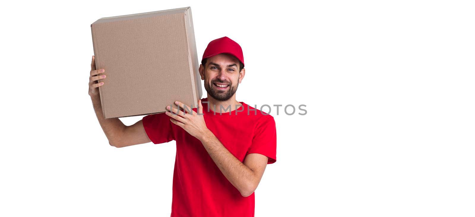 courier man holding his shoulder big delivery box