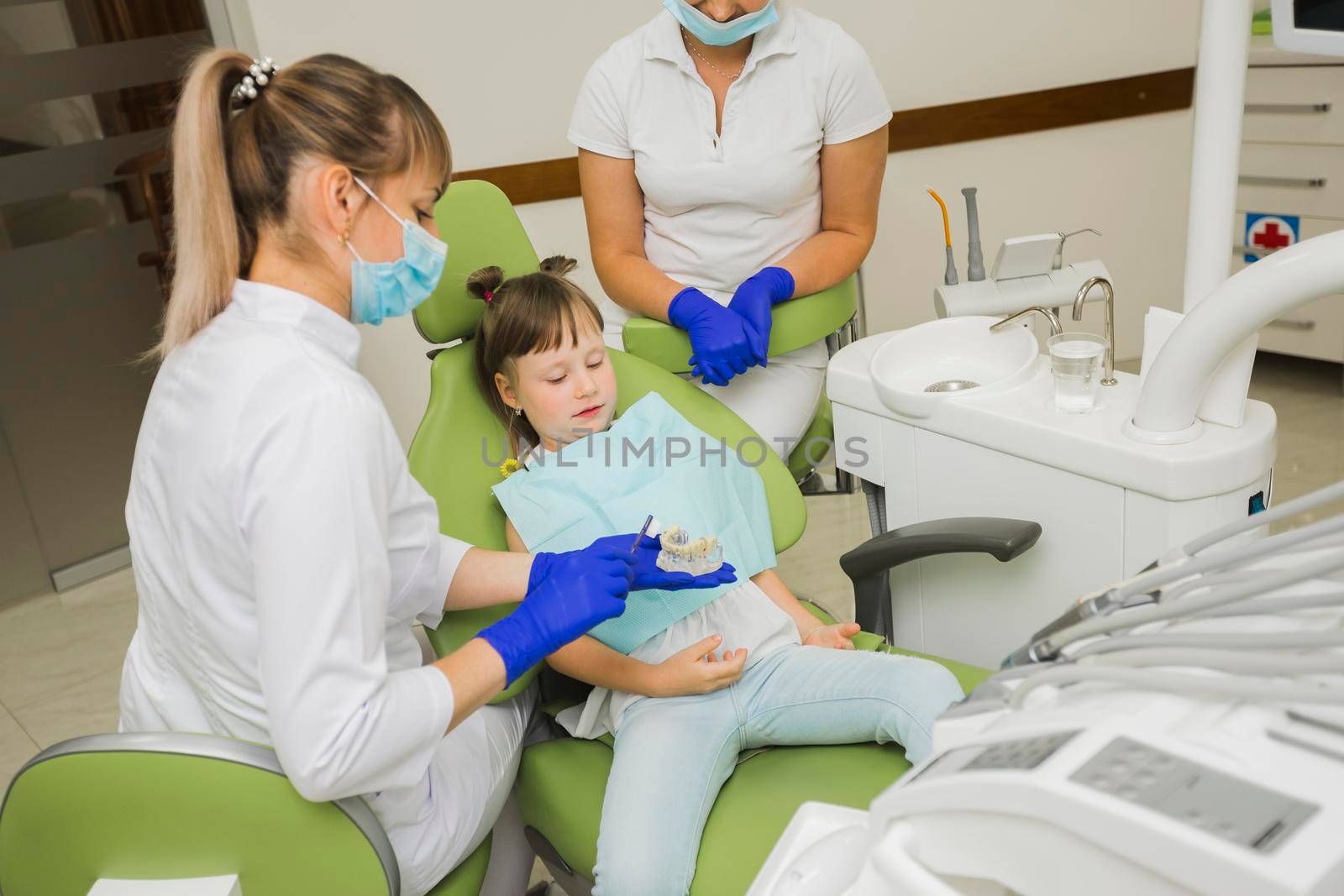 dentist girl looking dentures by Zahard