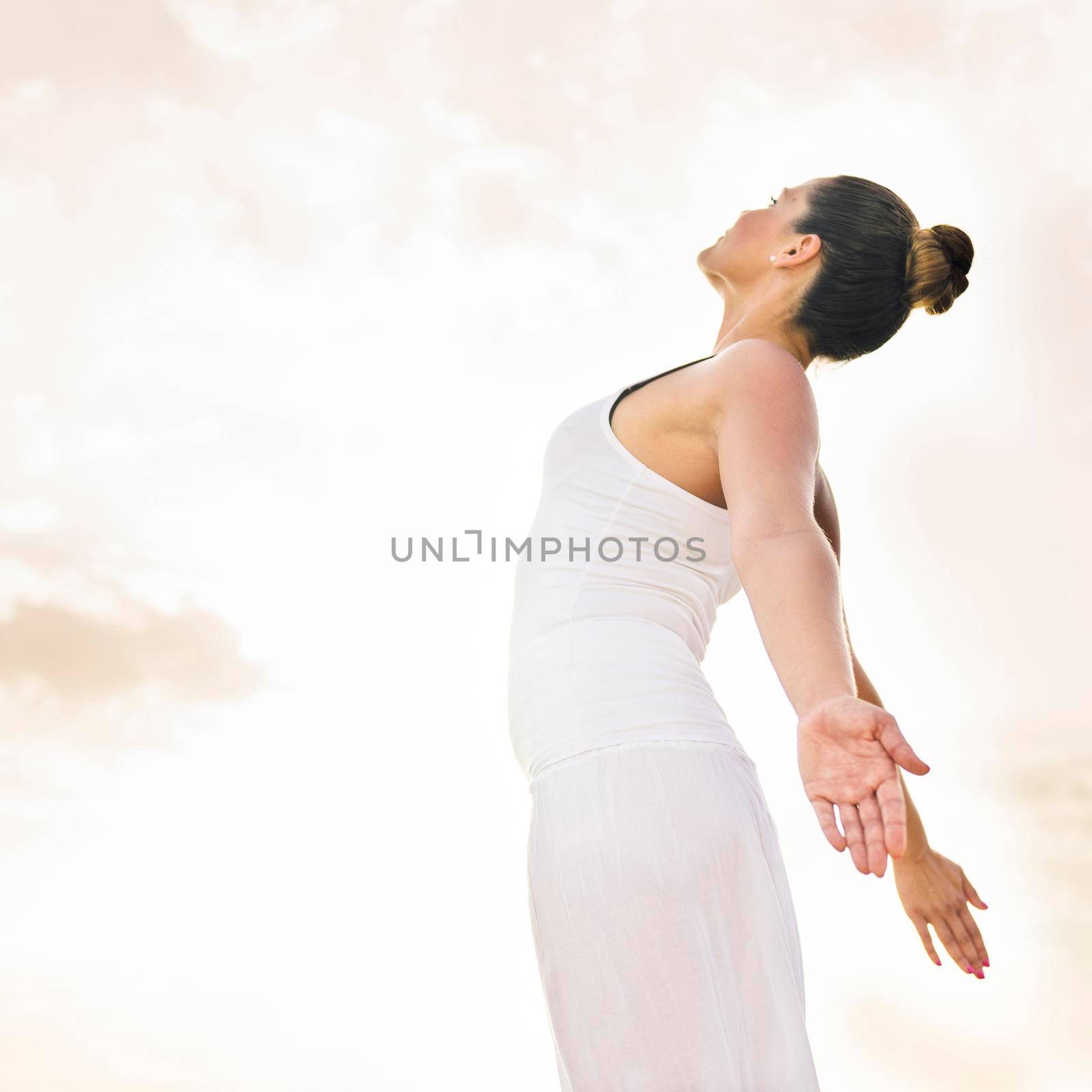 happy woman doing yoga sun