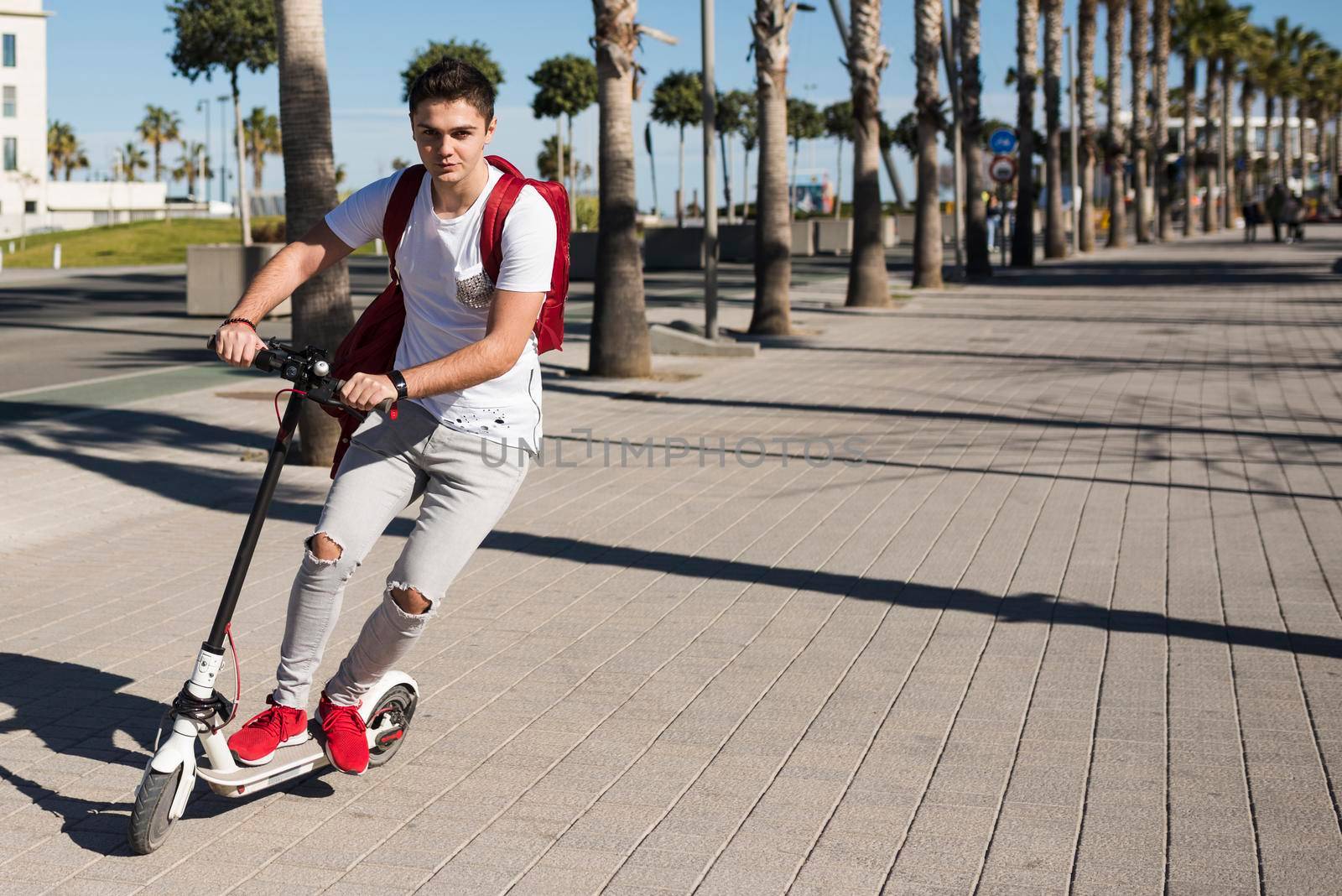 teenage boy with scooter by Zahard
