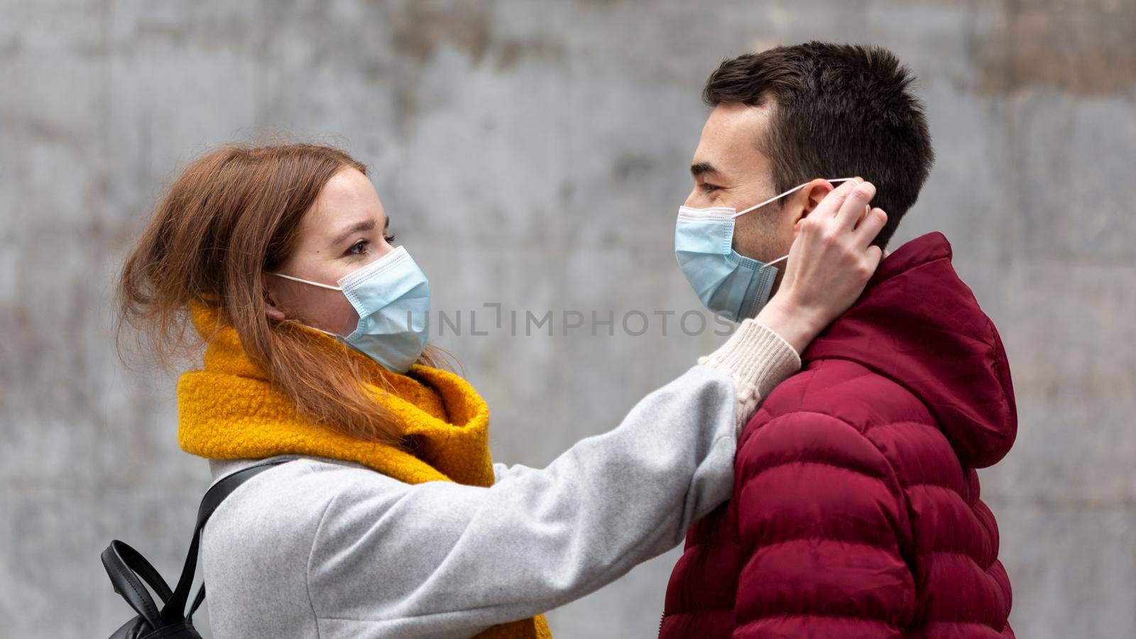 side view girlfriend fixing boyfriend s medical mask by Zahard