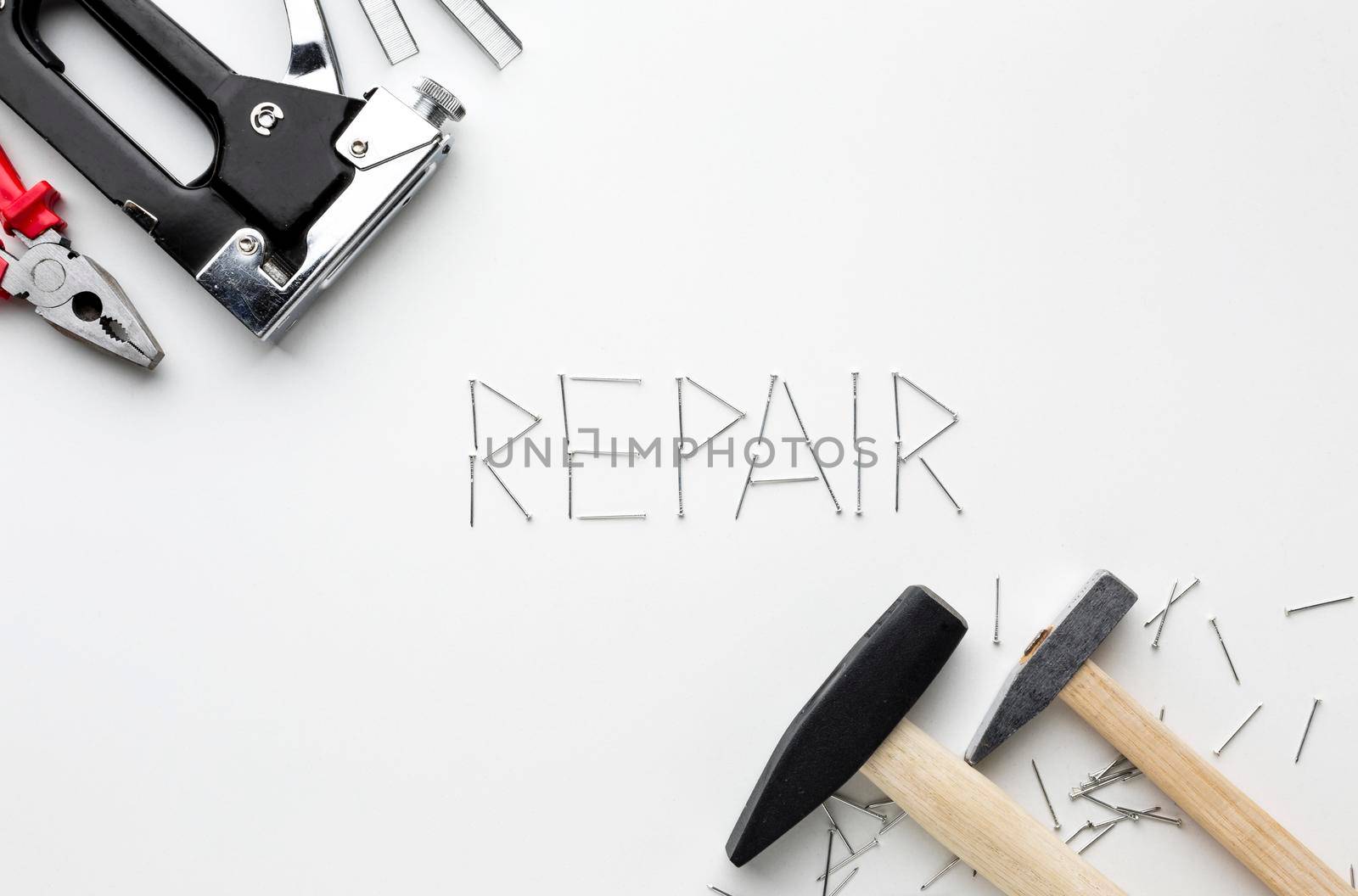 hammers repair word written with nails