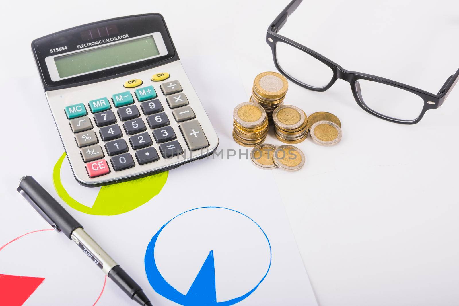 calculator with coins stacks table