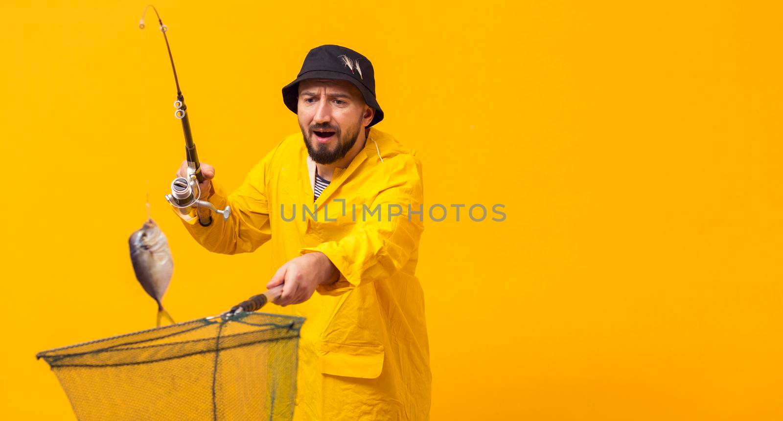 front view fisherman holding fishing rod net with copy space by Zahard