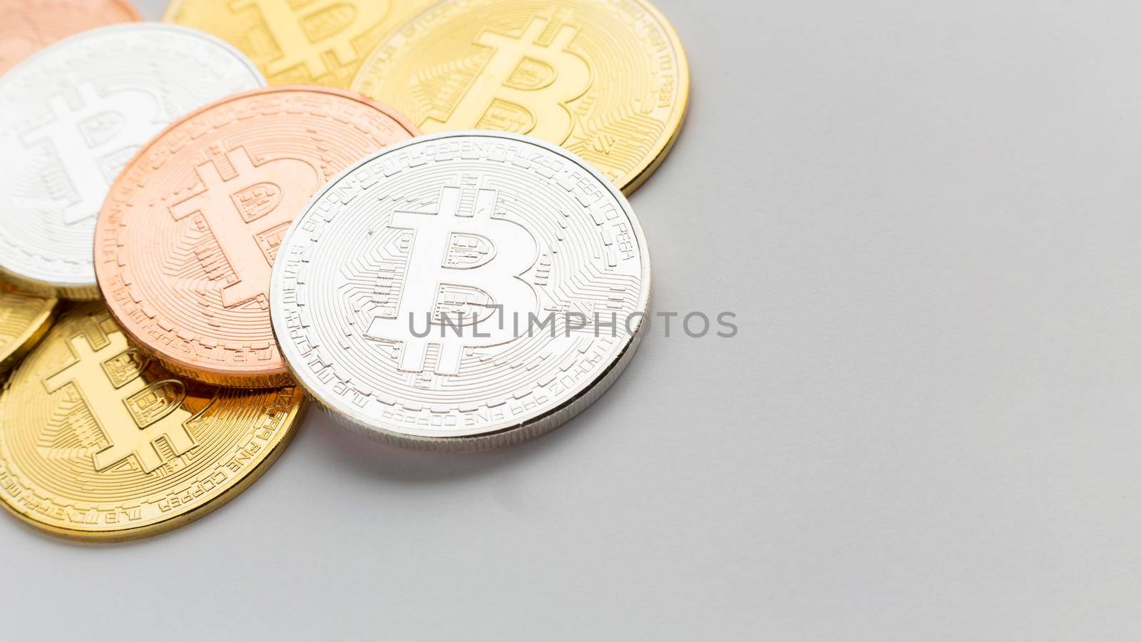 bitcoin various colors close up by Zahard