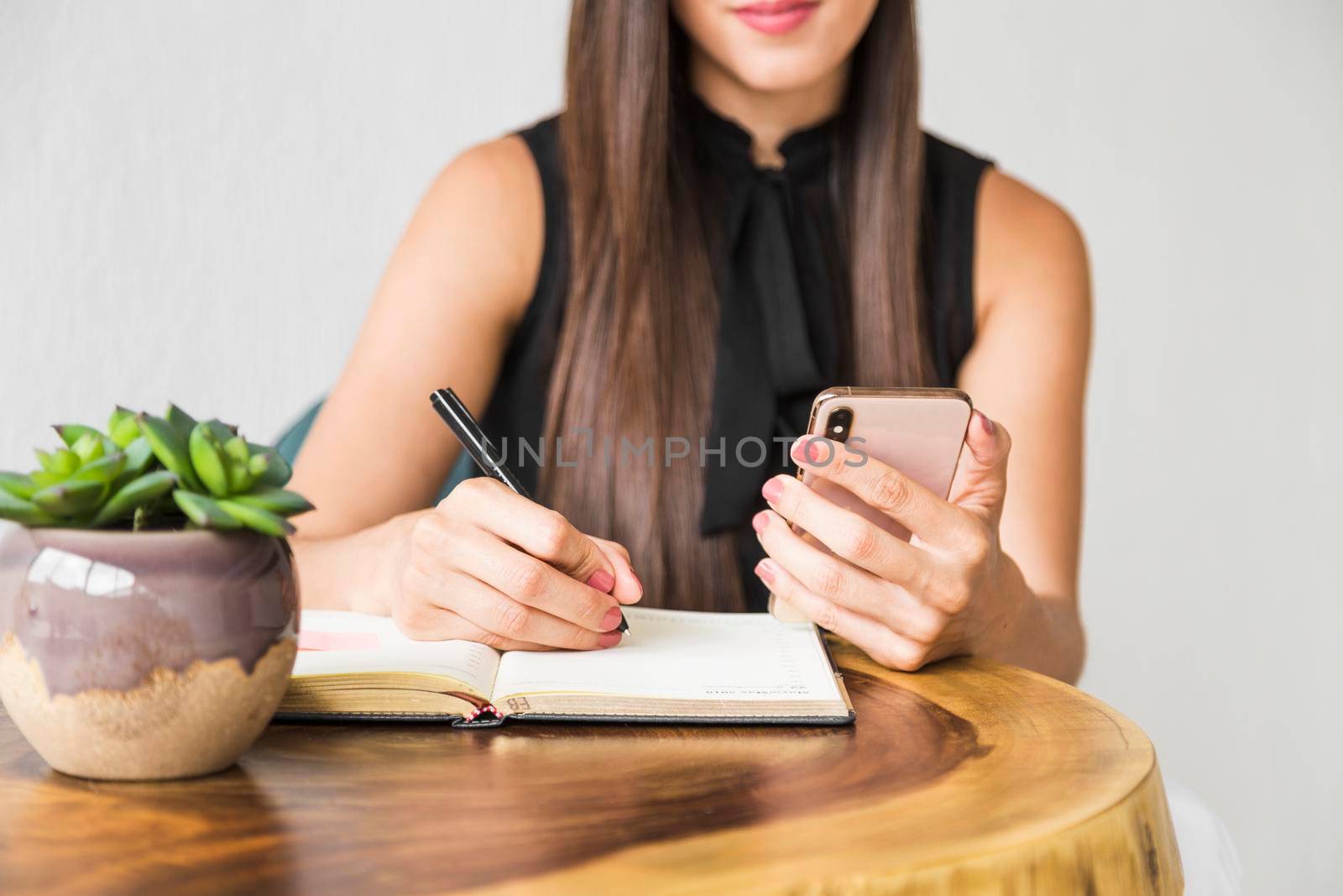 business woman writing from phone