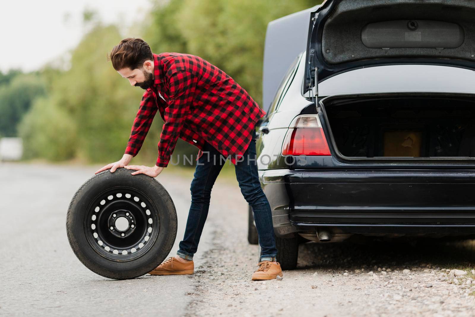 side view man with spare tyre by Zahard