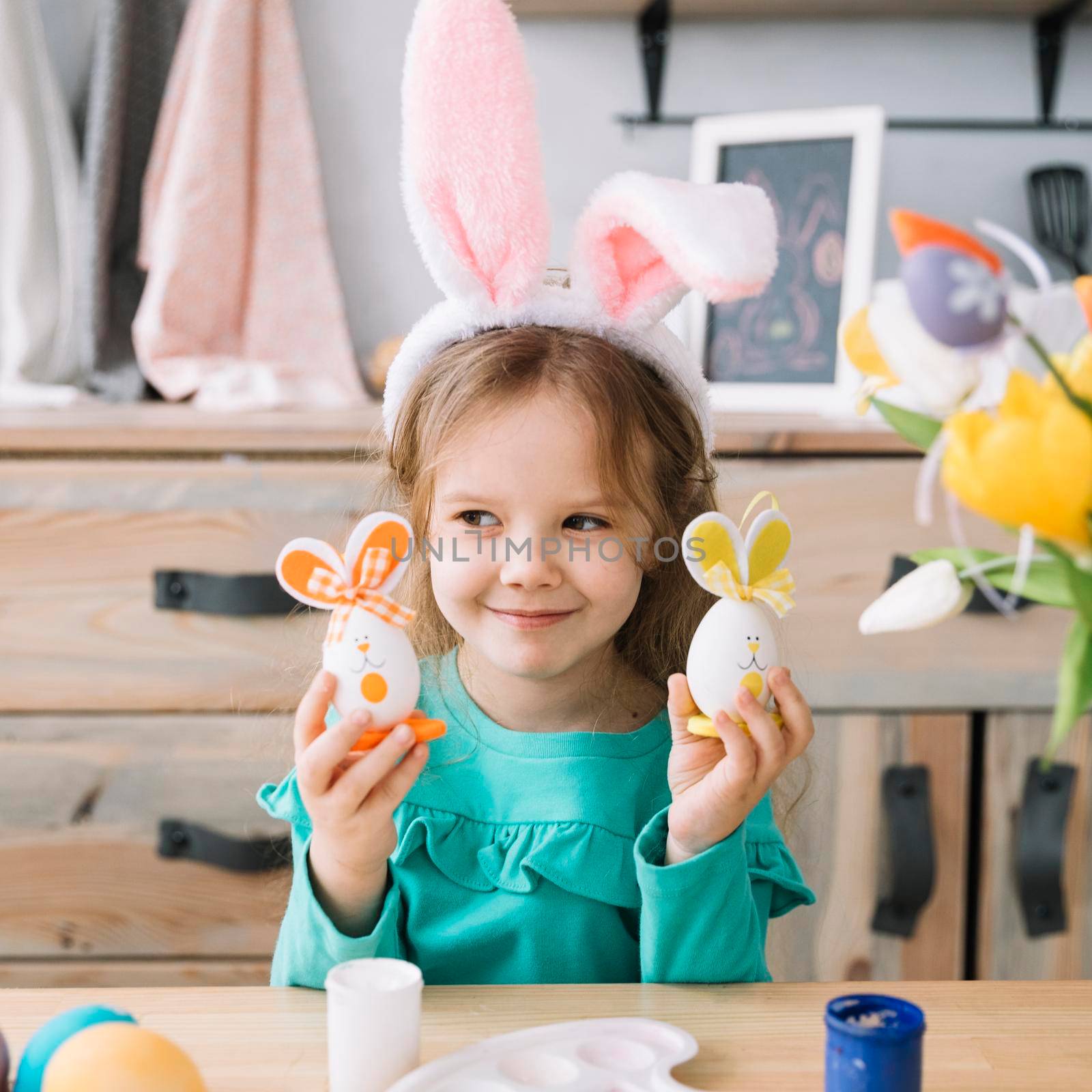 cute girl bunny ears holding easter eggs
