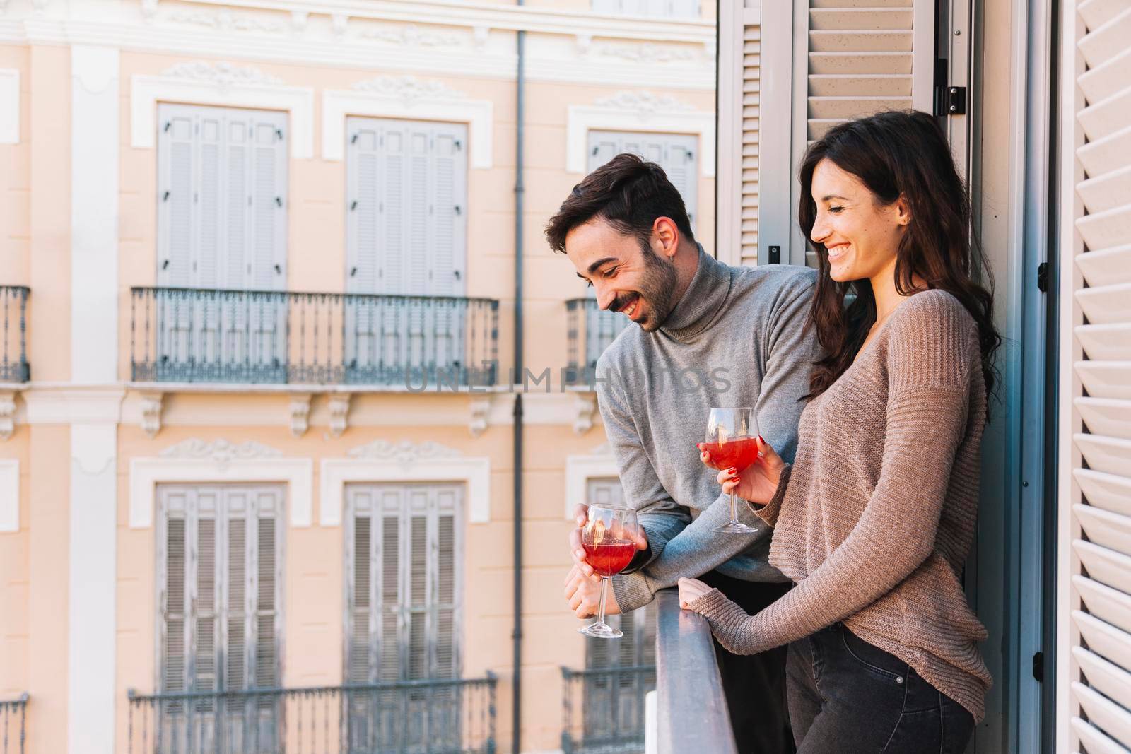 couple drinking balcony