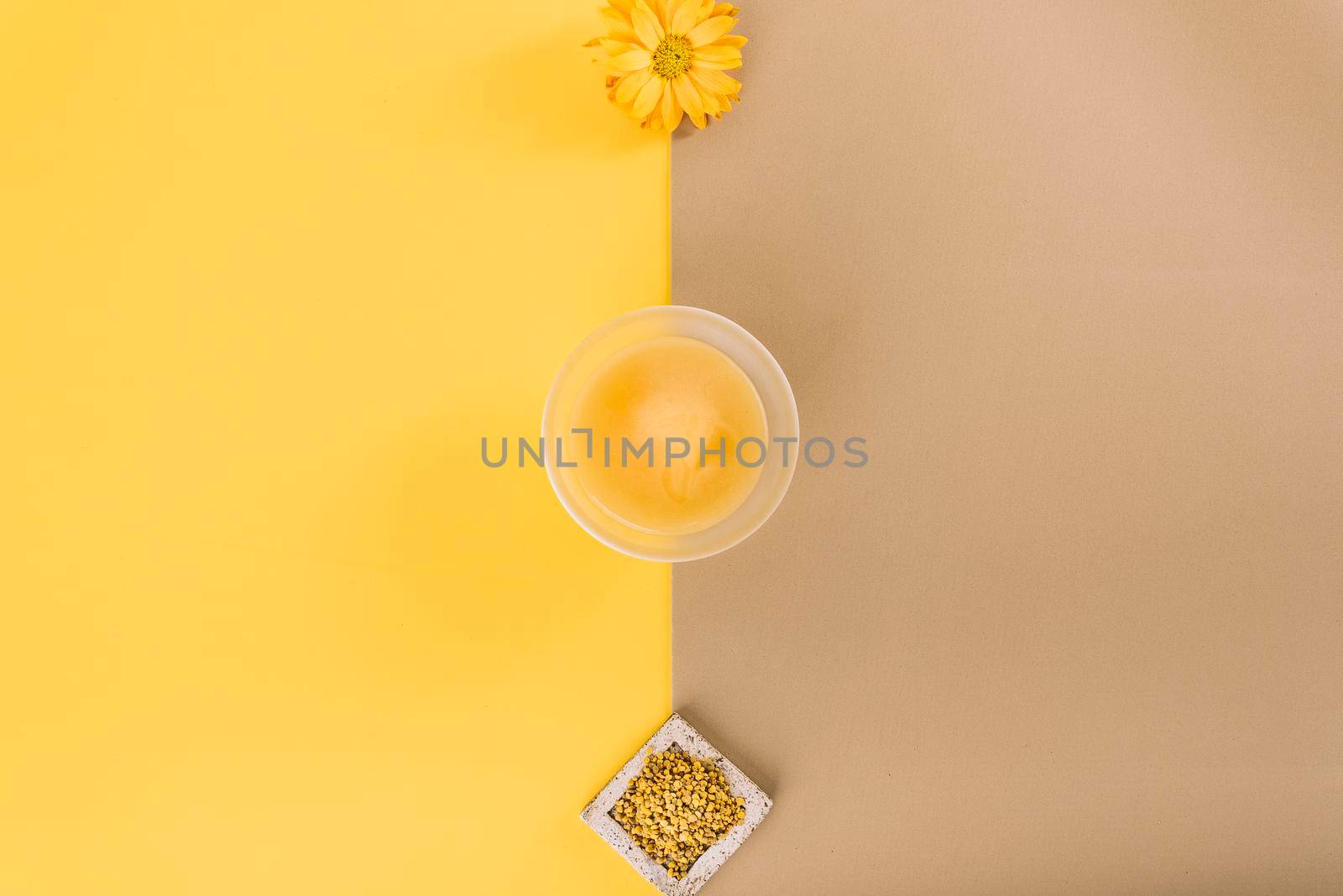 elevated view flowers lemon curd bee pollen dual colored background by Zahard