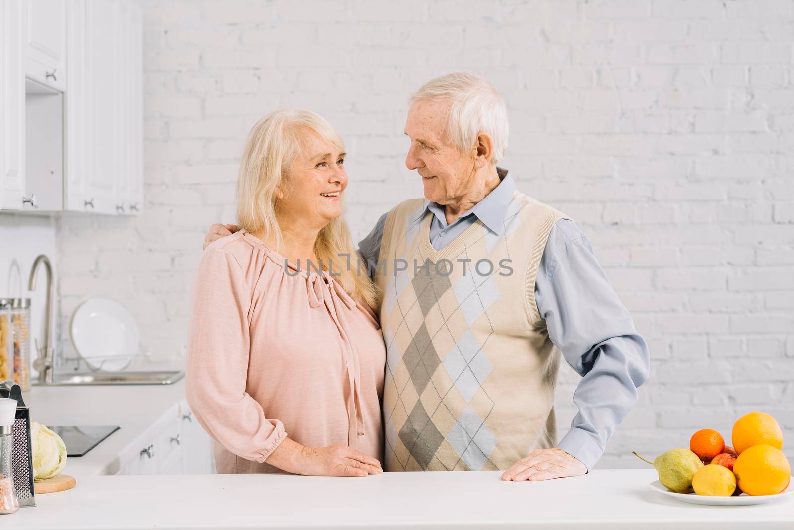 senior couple together kitchen