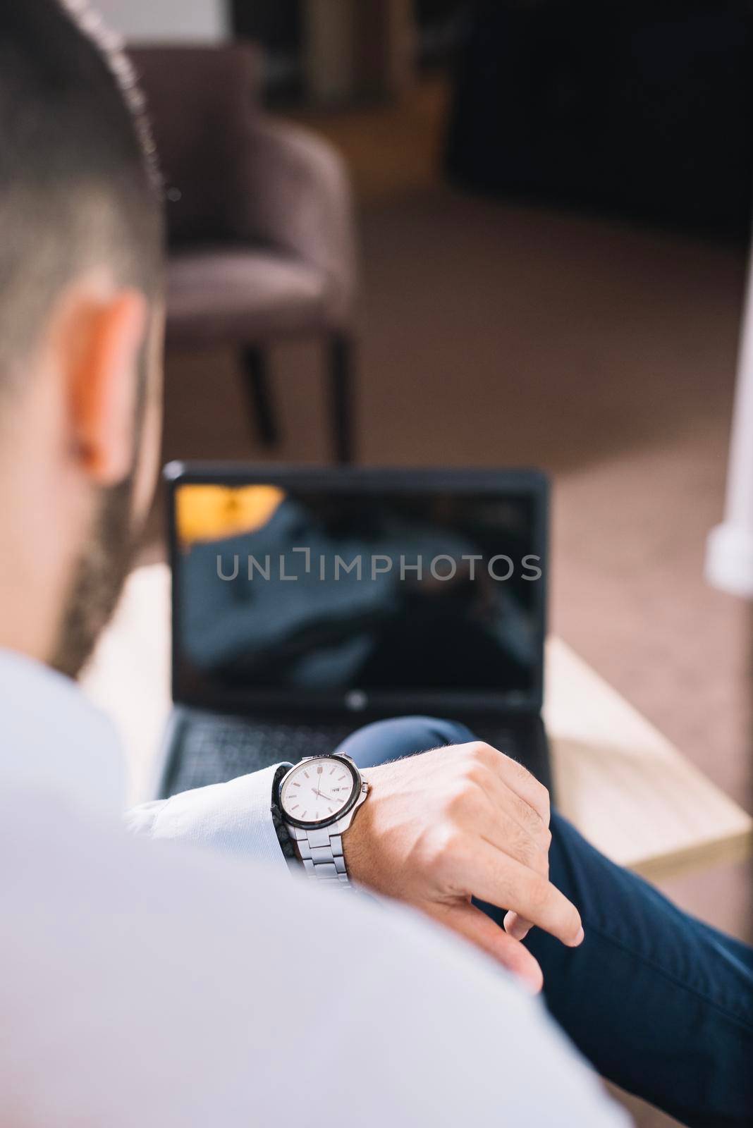 businessman looking wristwatch by Zahard