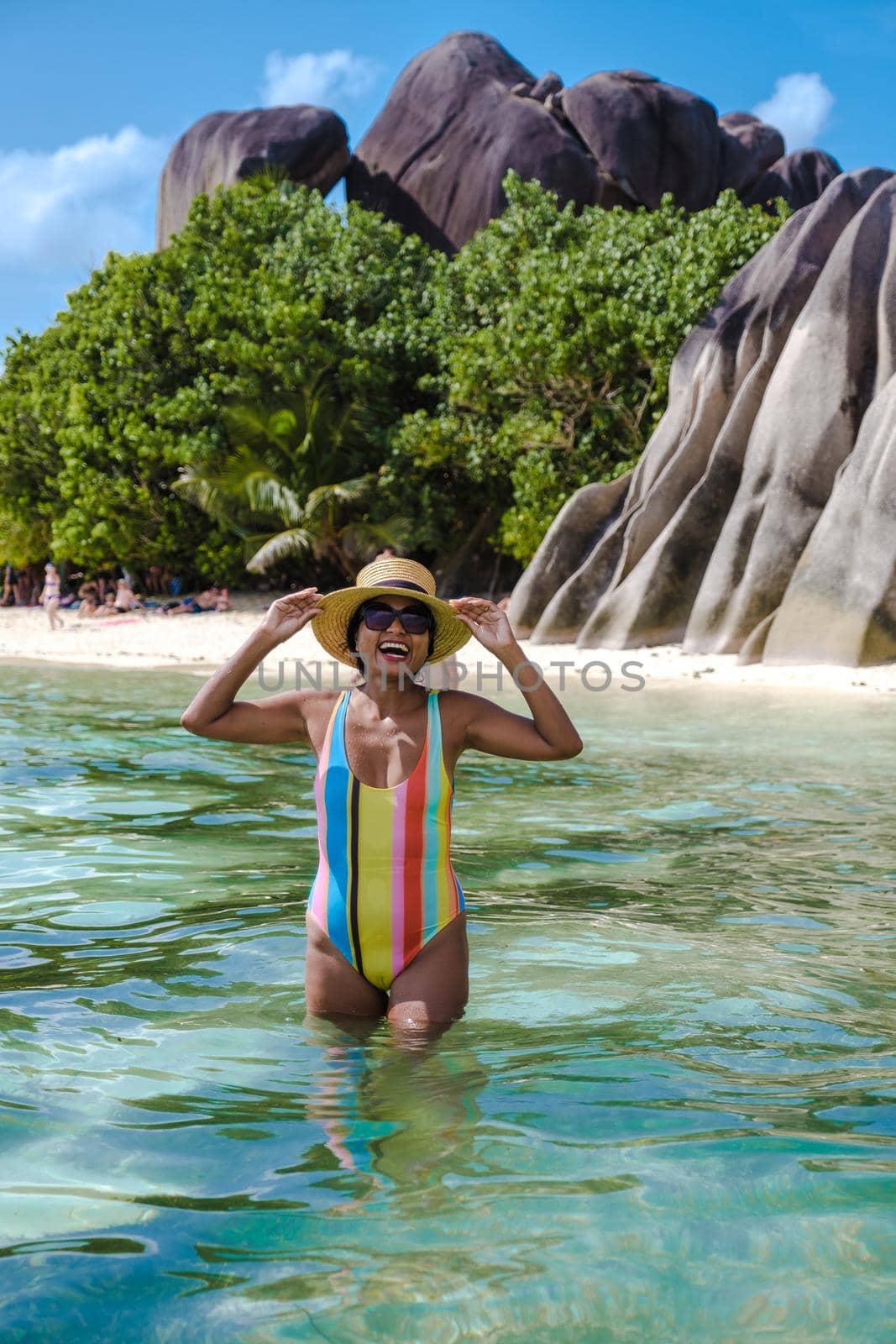 Anse Source d'Argent beach, La Digue Island, Seyshelles, La Digue Seychelles , young Asian woman on the beach by fokkebok