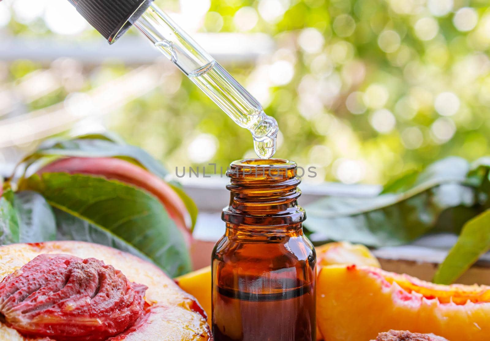 Peach seed oil in a bottle. Selective focus.food