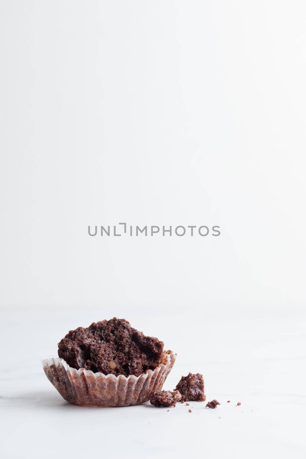 Started chocolate muffin on a white background copy space