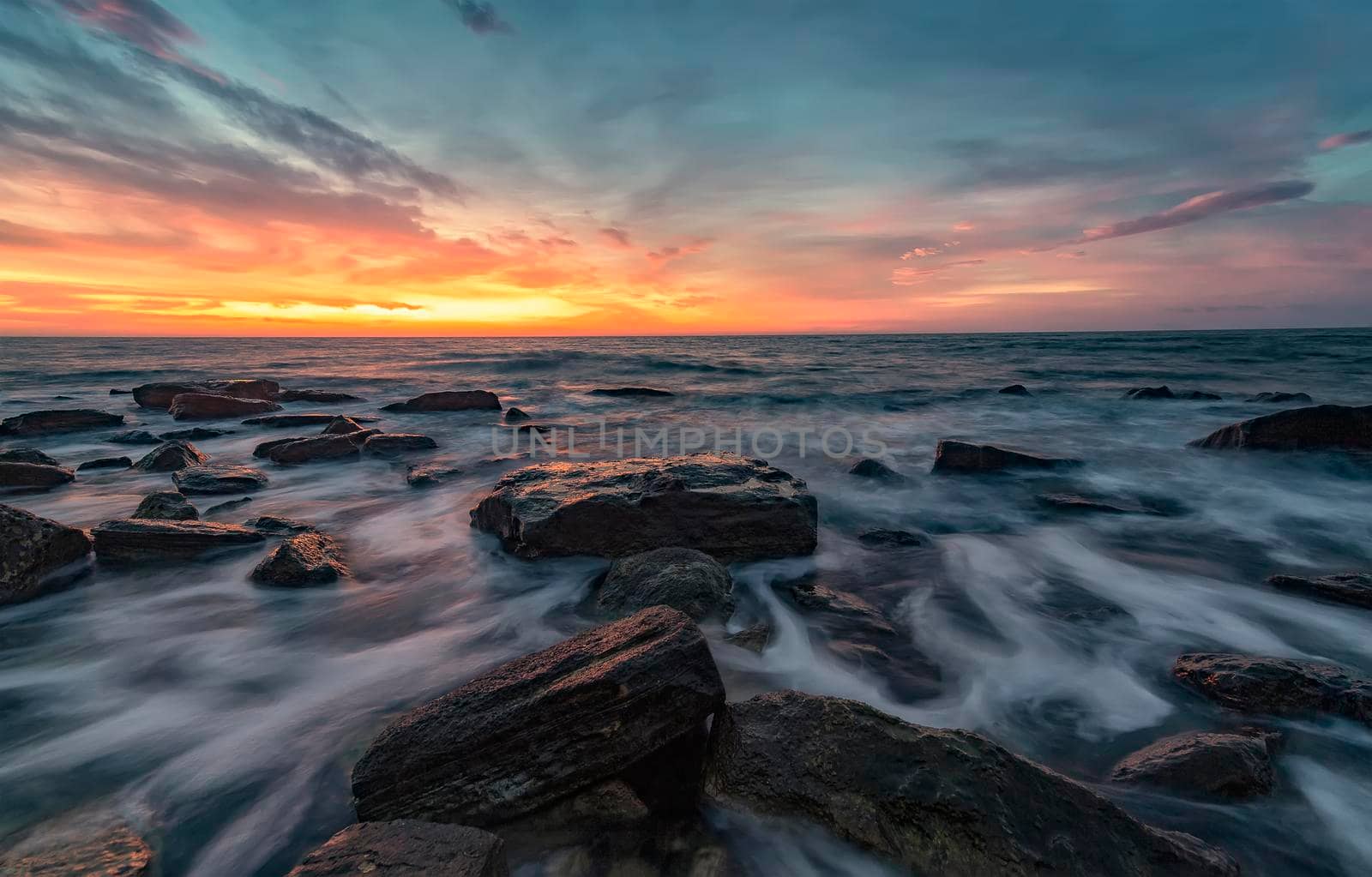 Seascape with rocks during sunrise. Stunning natural seascape. Sea sunrise at the Black Sea coast. 