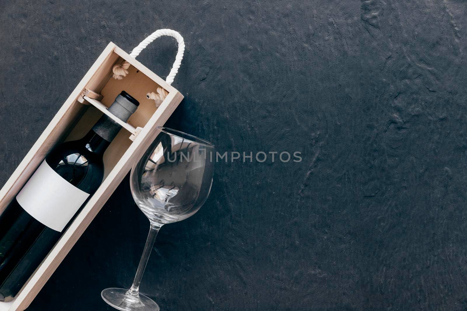 empty glass near box with wine by Zahard
