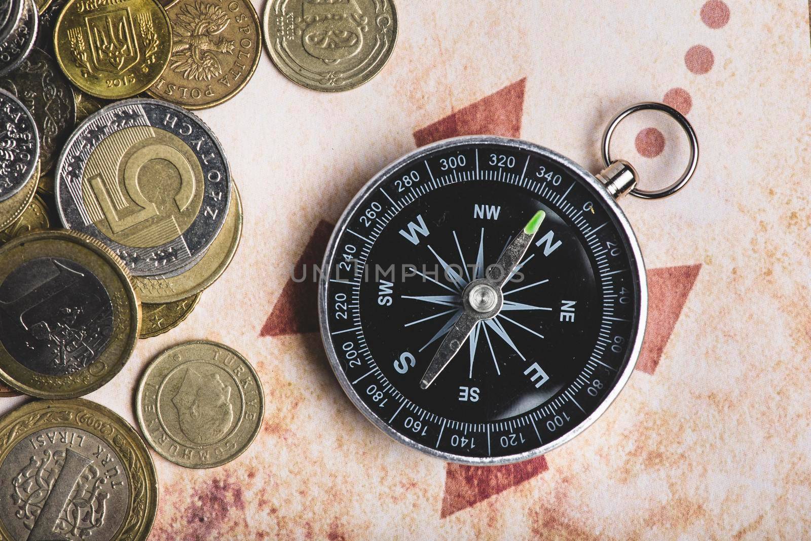 close up coins compass by Zahard