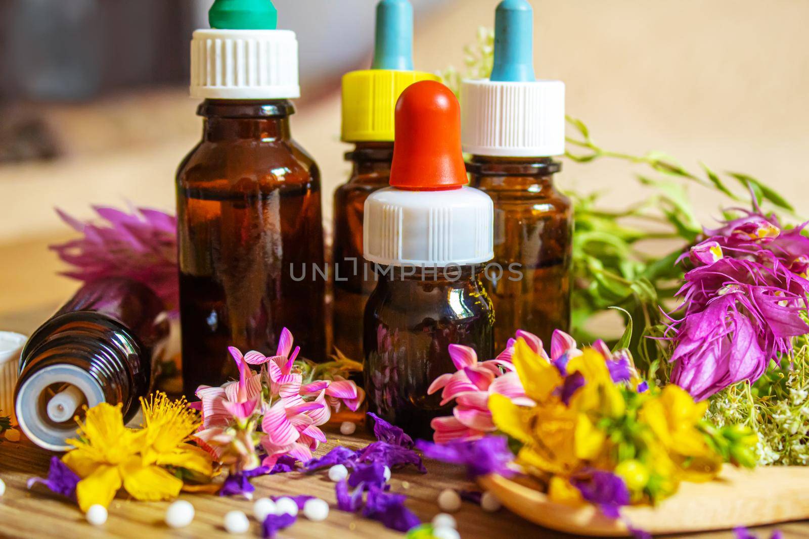 medicinal herbs, oils in small bottles homeopathy. selective focus.nature