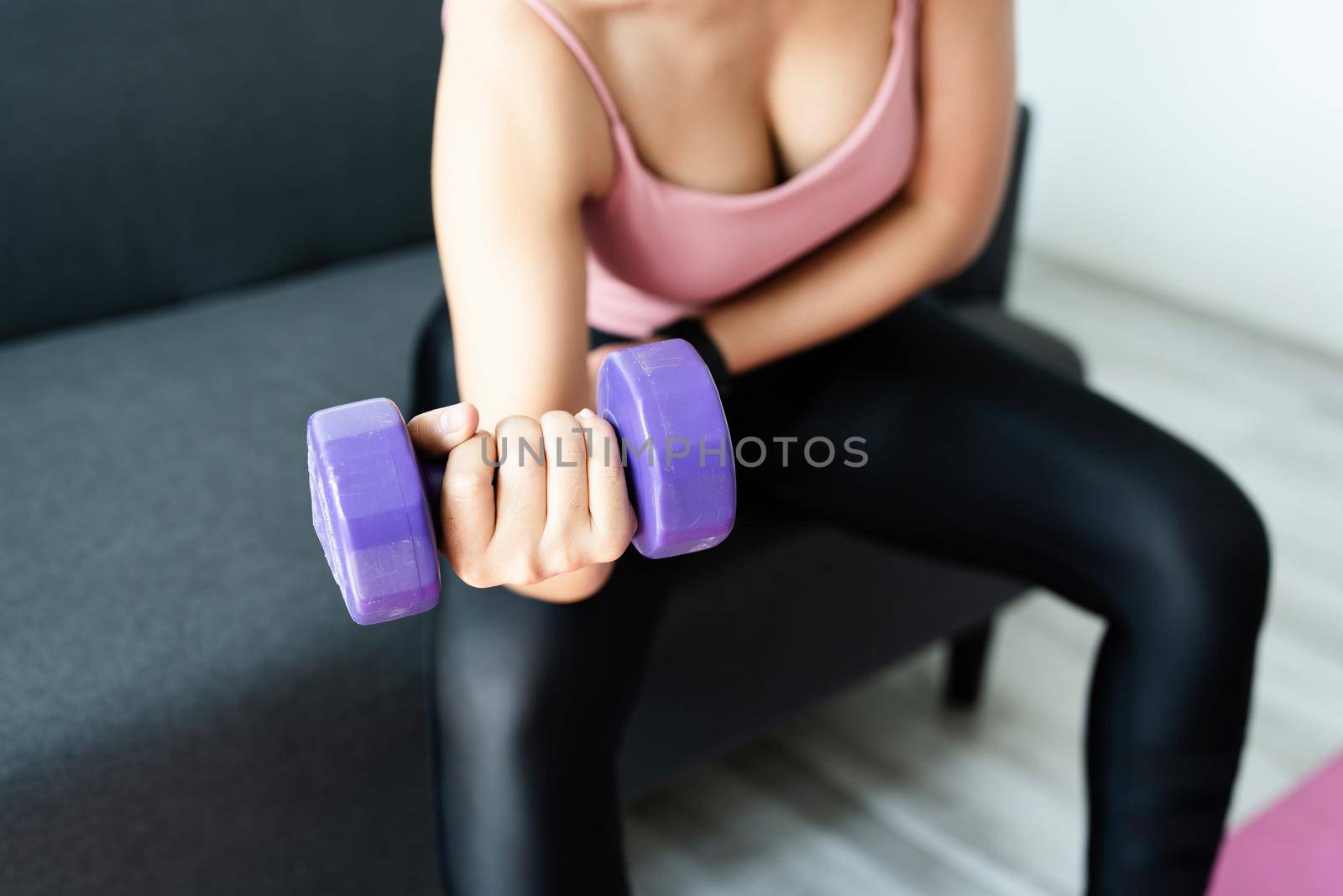 stress relief, , breathing exercises, meditation, portrait of Asian healthy woman lifting weights to strengthen her muscles after work. by Manastrong