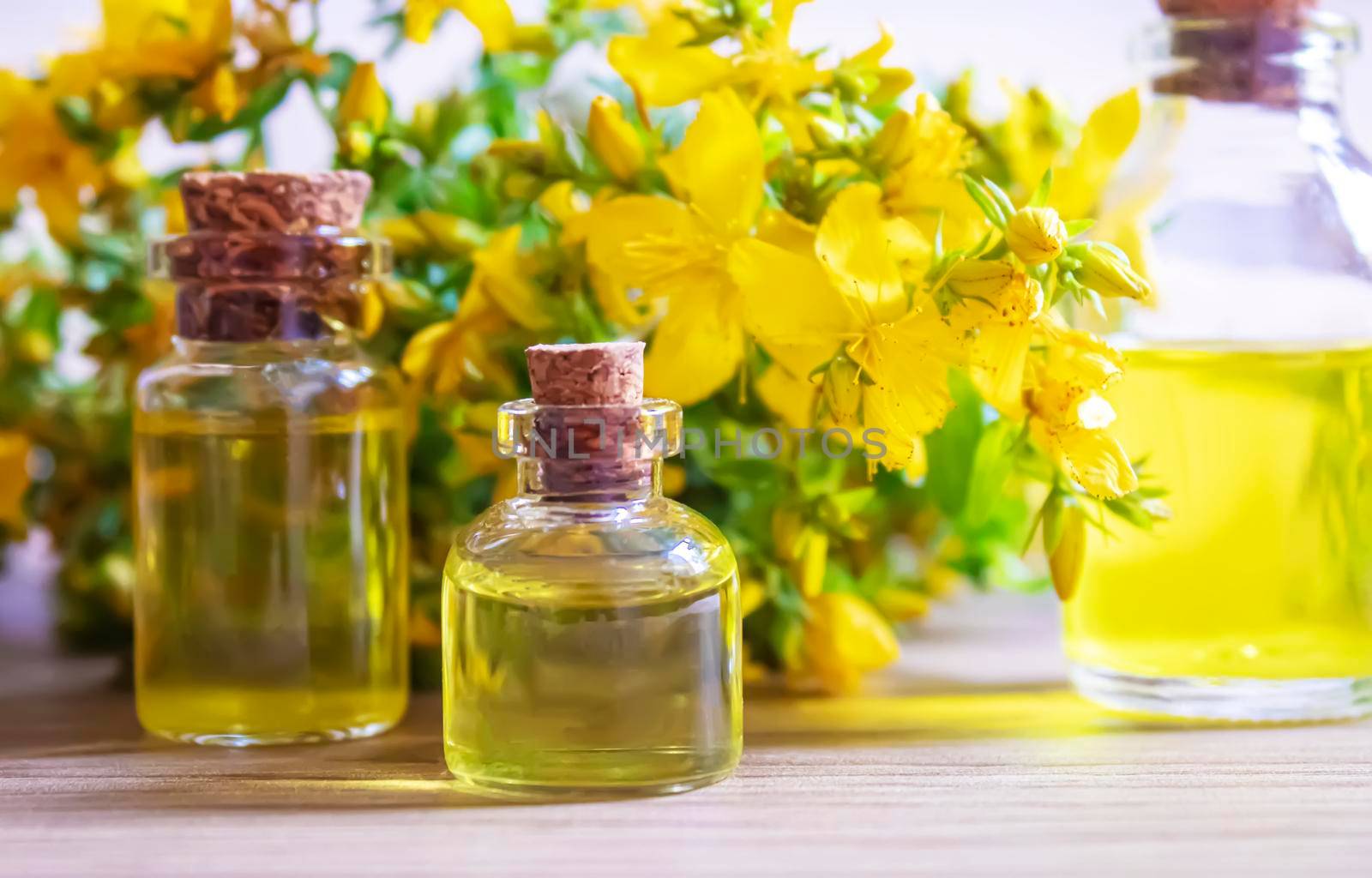 extract St. John's wort in a small jar. Selective focus. by mila1784