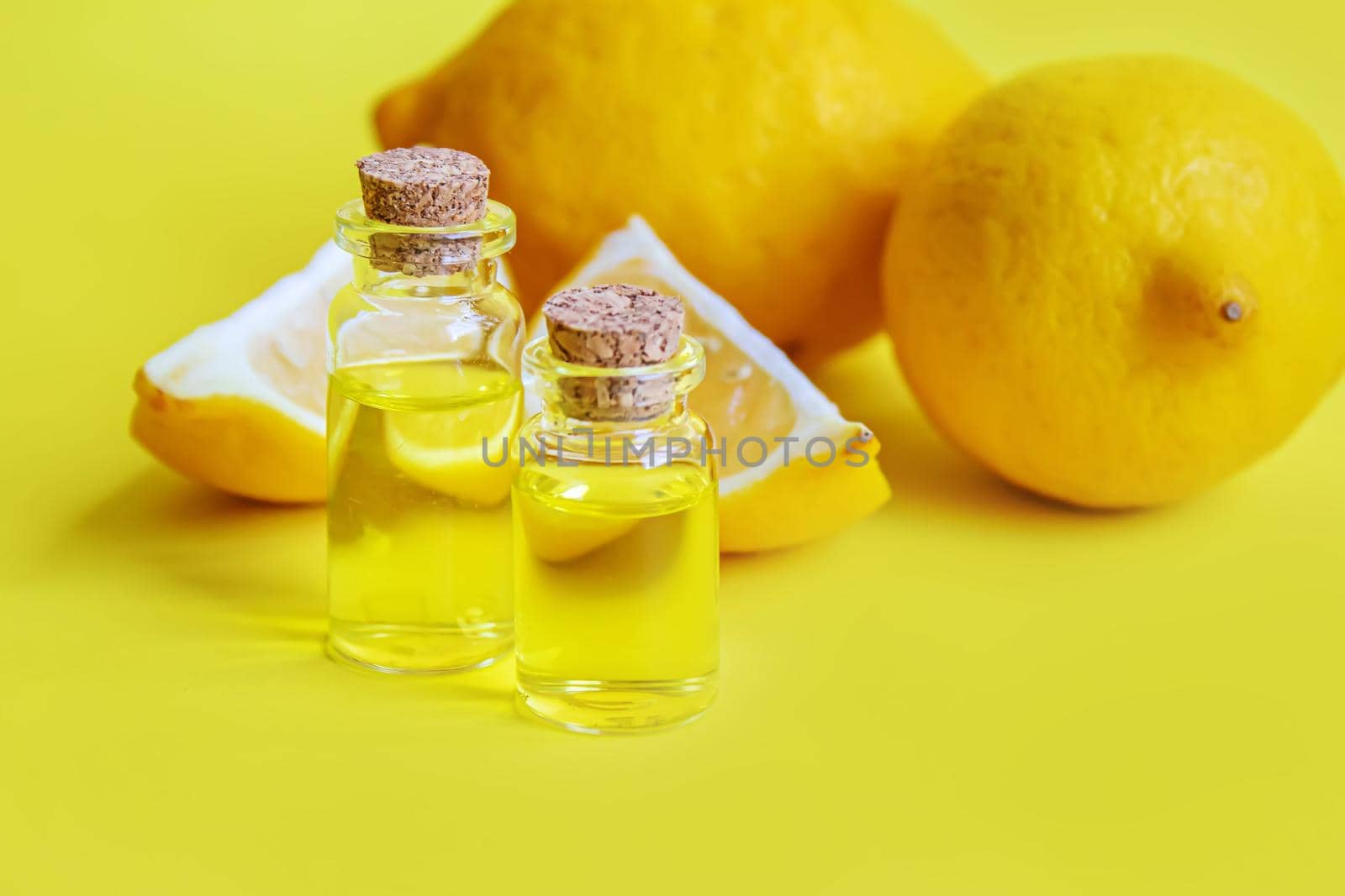 lemon essential oil on a yellow background. Selective focus.nature