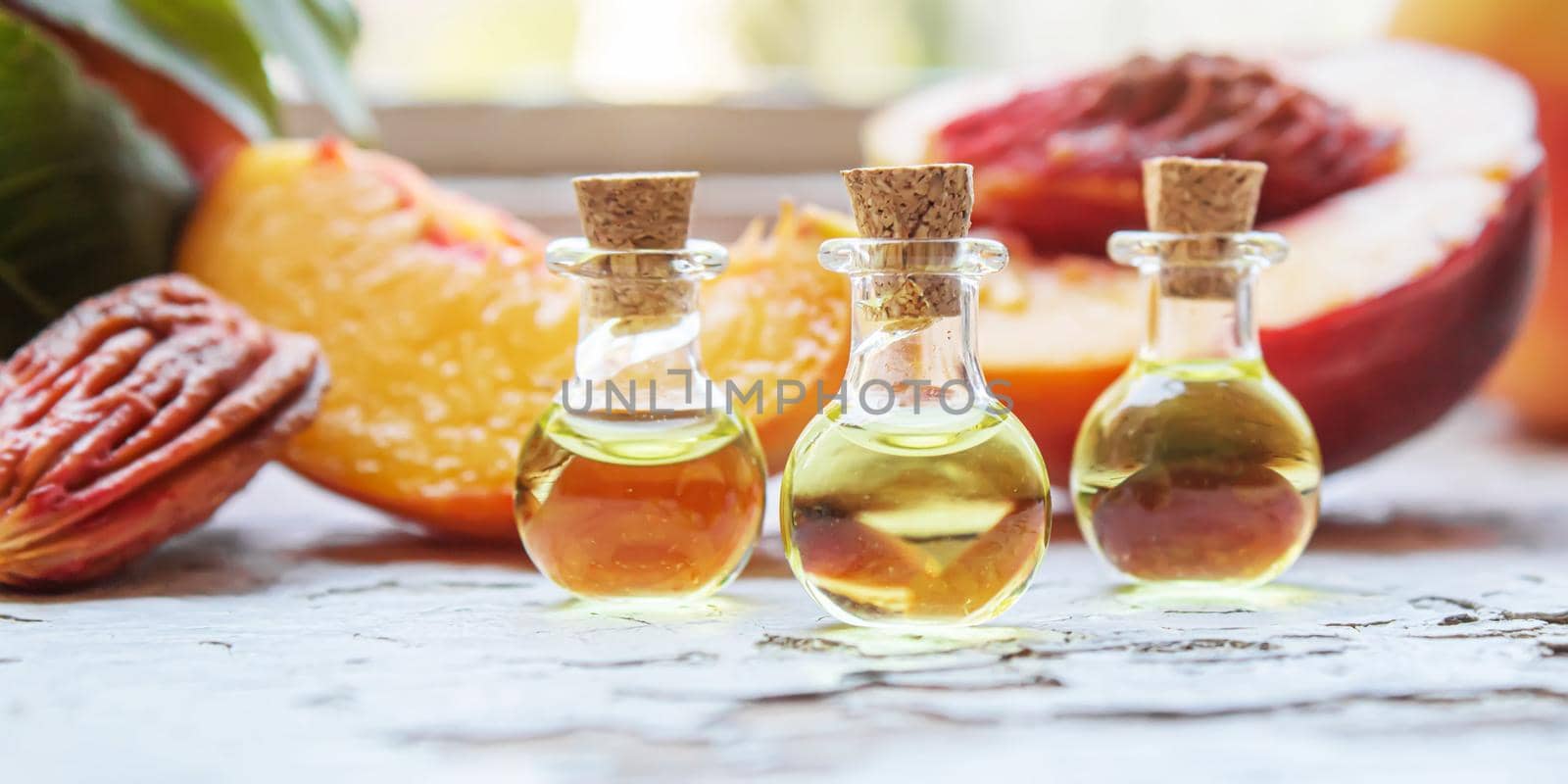 Peach seed oil in a bottle. Selective focus. by mila1784