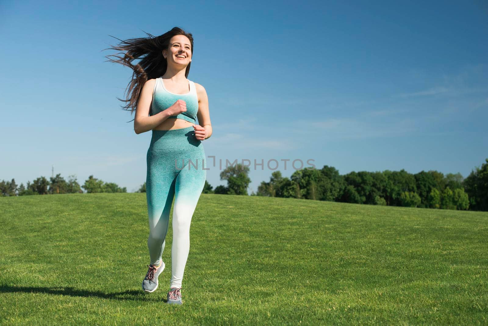 athletic woman running outdoor park
