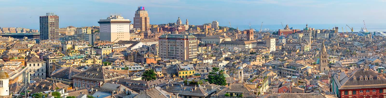 Italy, urban view of the skyline of the historic city of Genoa in Liguria, old and new buildings with views of the commercial port, travel reportage