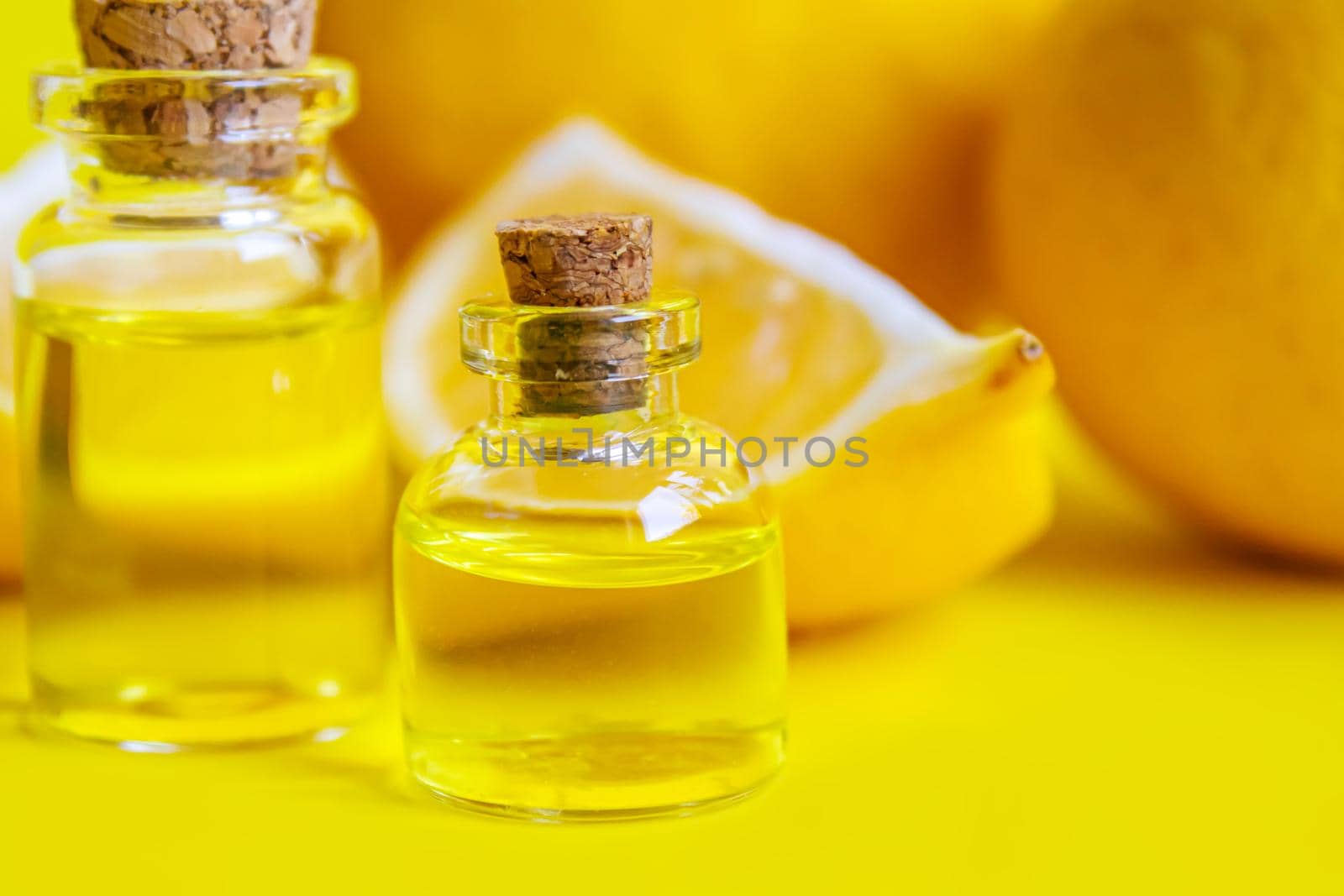 lemon essential oil on a yellow background. Selective focus.nature