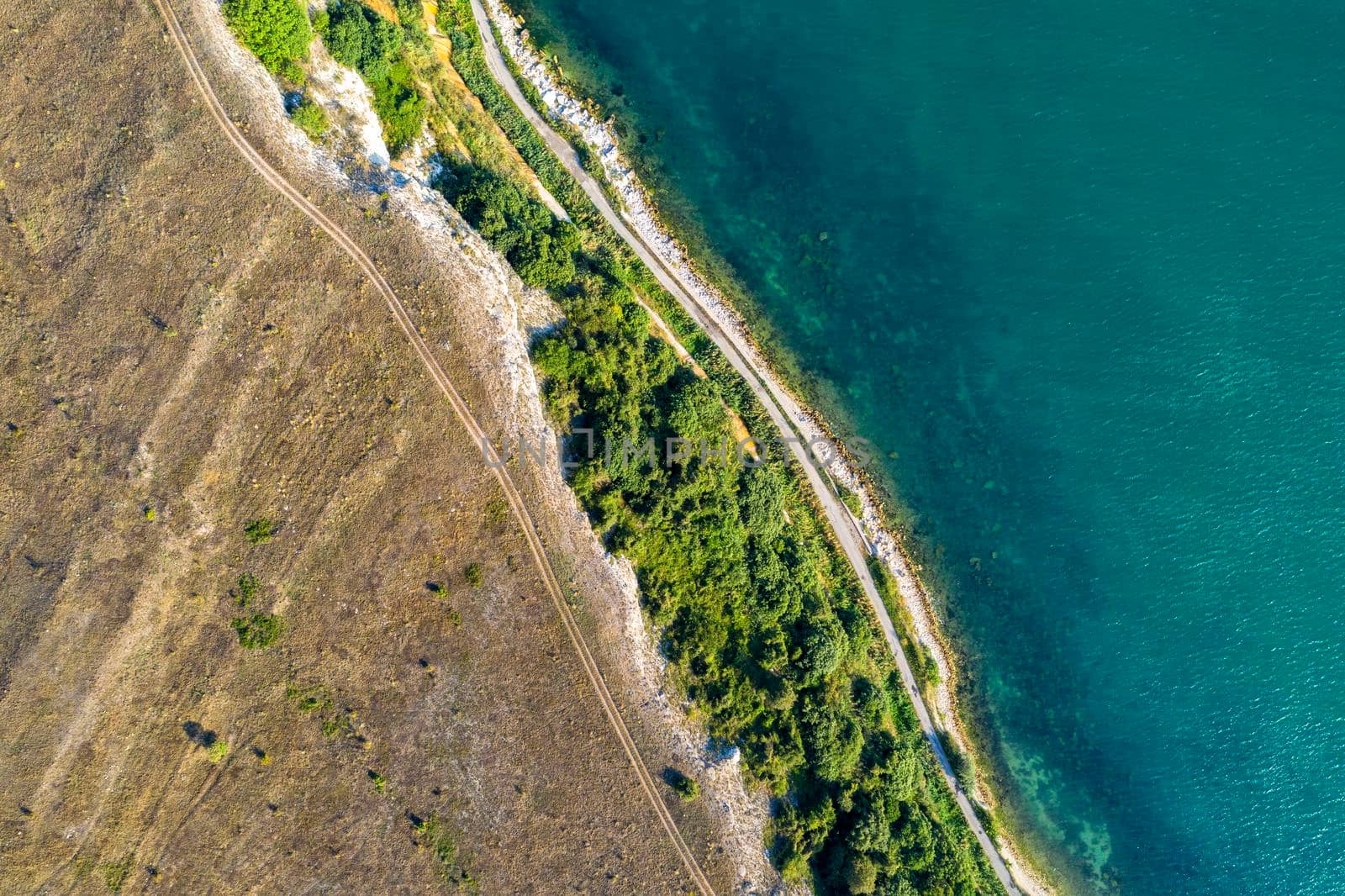 Beauty sea and steep coastline surface aerial top view from the drone.