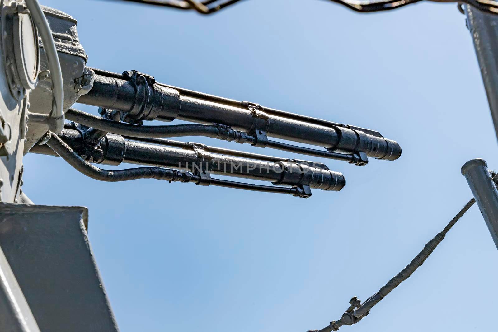 Close-up of a tower with a ship gun. Ship weapon tower. Naval exercises, attack, and defense.