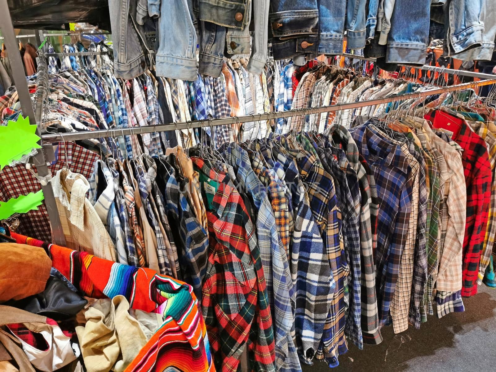 vintage dresses and shirts for sale in the used clothing store