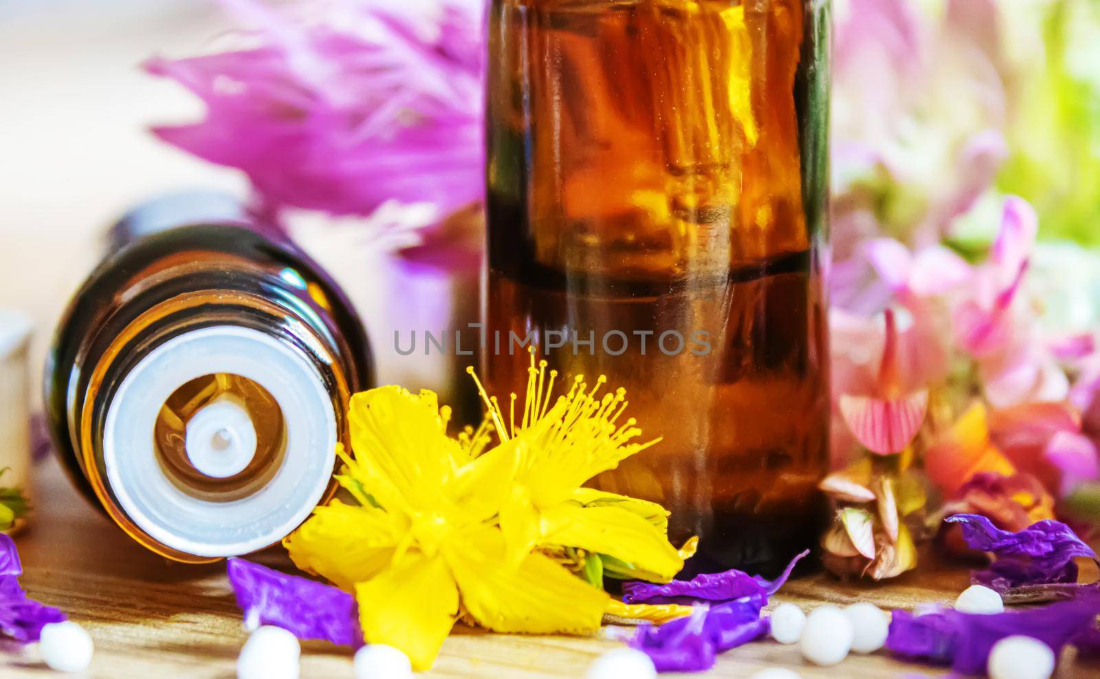 medicinal herbs, oils in small bottles homeopathy. selective focus.nature