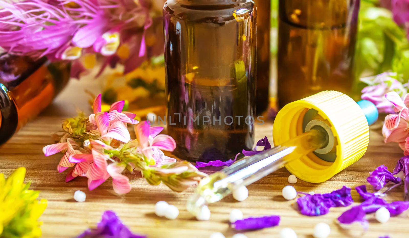 medicinal herbs, oils in small bottles homeopathy. selective focus. by mila1784