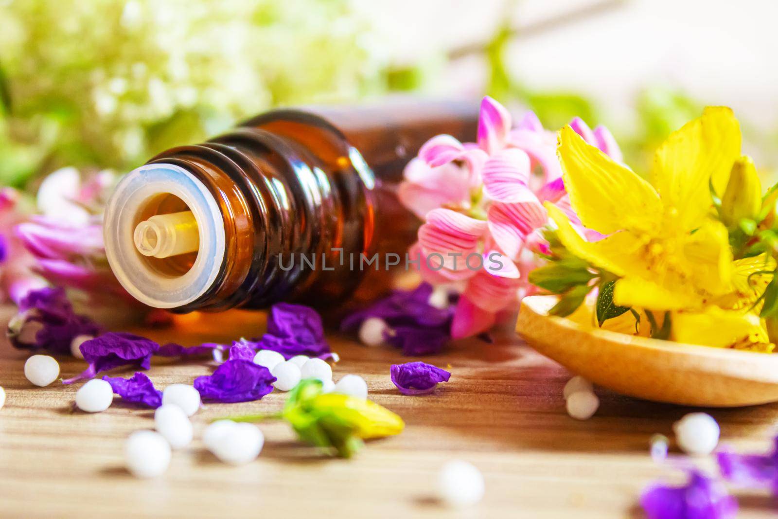 medicinal herbs, oils in small bottles homeopathy. selective focus. by mila1784