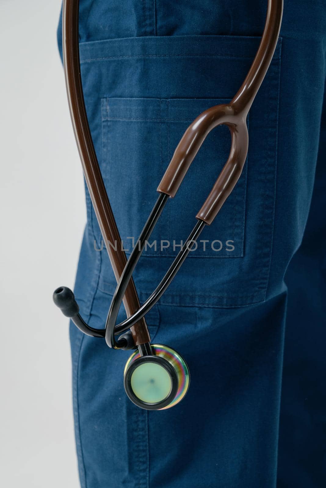 Brown medical stethoscope.A doctor with a stethoscope.A doctor holding a stethoscope.The concept of healthcare.