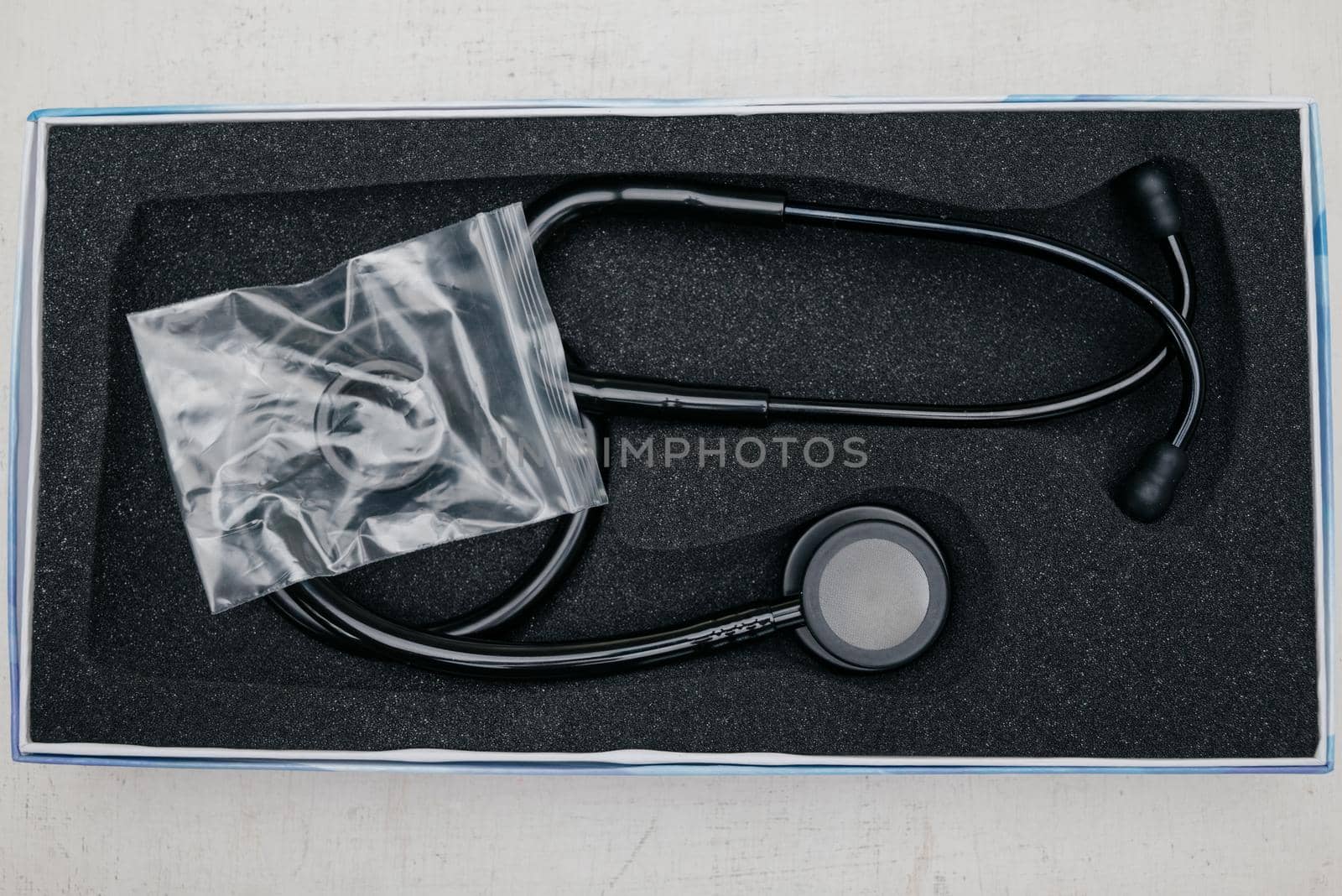 Medical stethoscope. Black medical stethoscope.The concept of healthcare.Stethoscope on a dark background