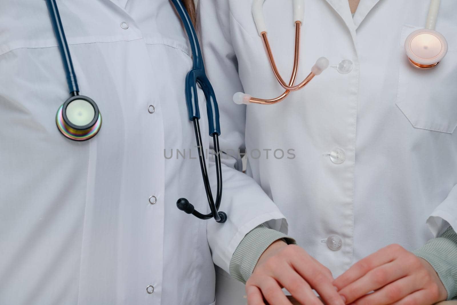 Medical stethoscope.White and blue stethoscopes..Doctors with stethoscopes.Doctors holding stethoscopes.The concept of healthcare.