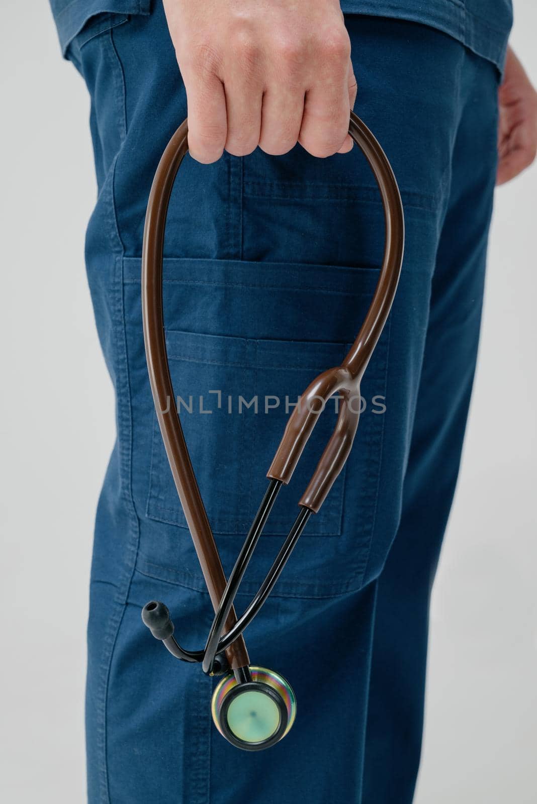 Brown medical stethoscope.A doctor with a stethoscope.A doctor holding a stethoscope.The concept of healthcare.