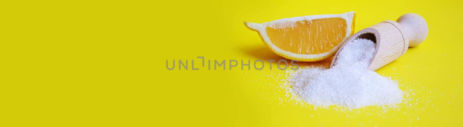 Citric acid on a yellow background. Selective focus. by mila1784
